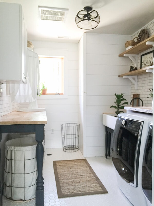 Farmhouse Laundry Room With Butcher Block Countertops and Shiplap