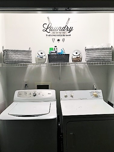 An organized and decorated laundry closet