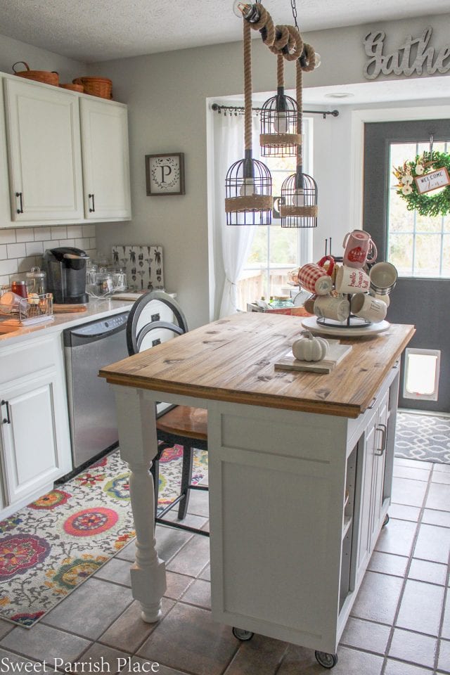 A kitchen island with a wood countertop