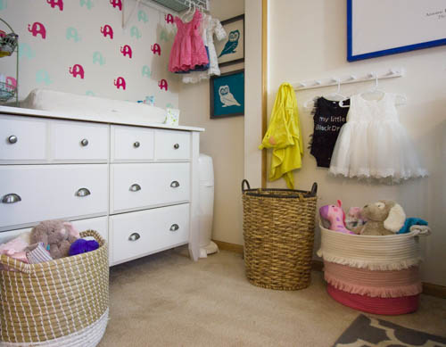 A small nursery with a changing table in a closet