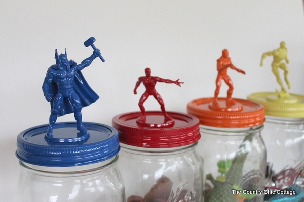 Mason jars with super heroes on the lids