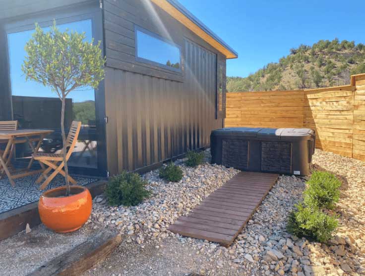 A tiny house in Utah with a hot tub