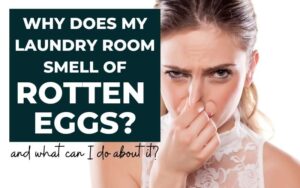 Young woman pinching her nose with text overlay stating "Why does my laundry room smell like rotten eggs and what can I do about it"?