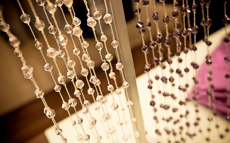 image of hanging brown beads in strings