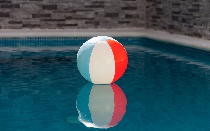 Photo of an inflatable ball floating on a pool