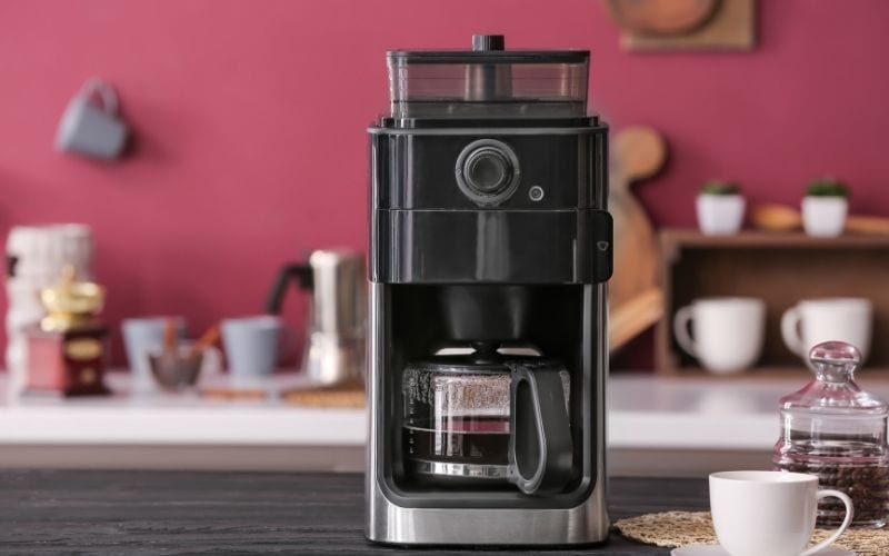 Photo of a coffee maker on a counter top in the kitchen