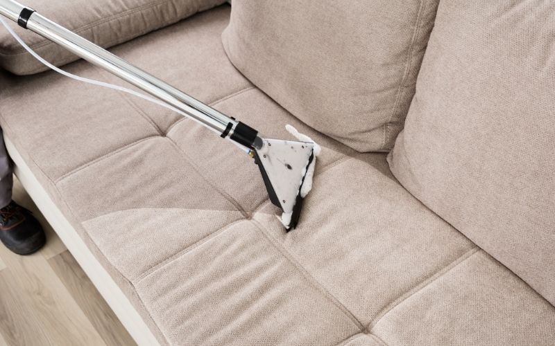 Image showing an upholstery being cleaned using a vacuum