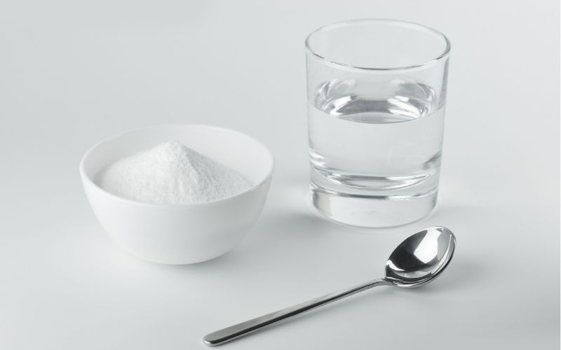 Image showing a spoon, a glass of water and a bowl with white powder