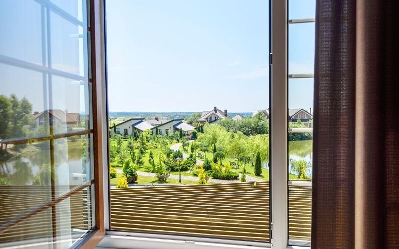 Photo of an open window from a higher place in the house