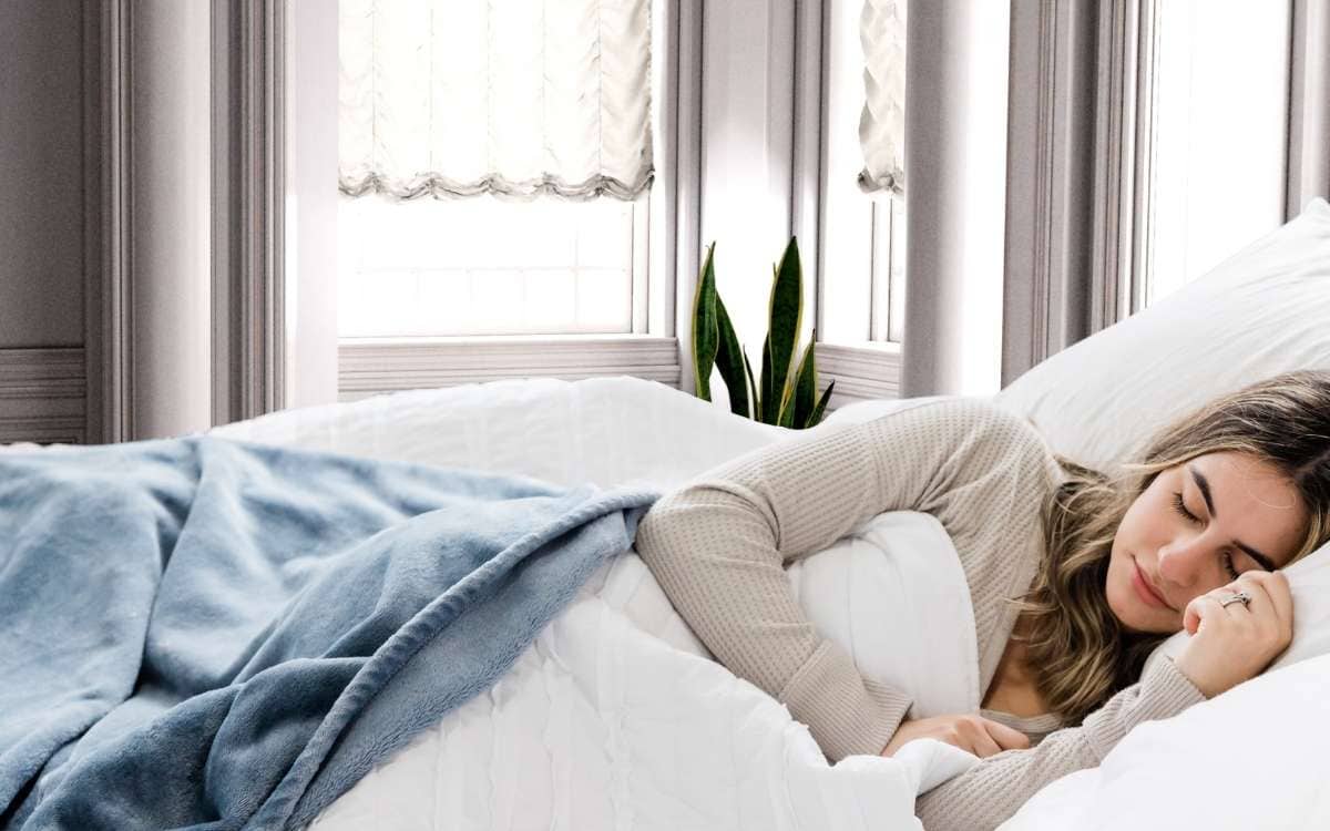 Photo of a woman sleeping in bed