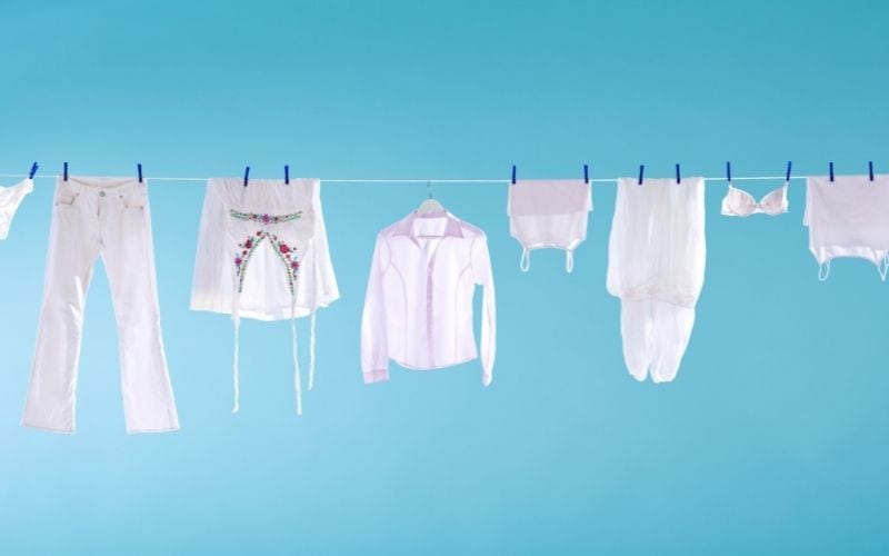 Photo showing white clothes hanging on a laundry line