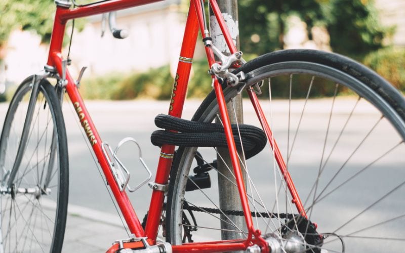 A bike with chain lock and securely tied in a post outside