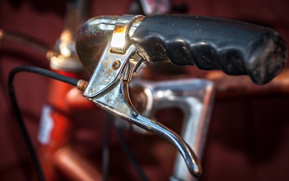 Photo of a part of a bike with rusting handle