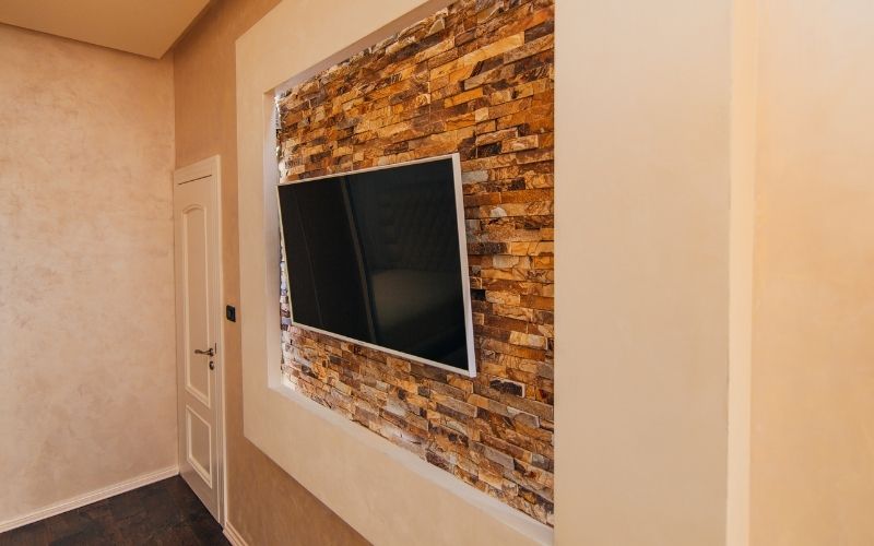 A flat screen tv on a wall